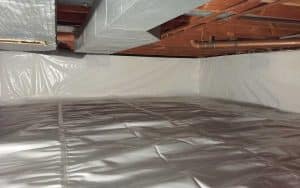 Crawl space after waterproofing with encapsulated walls and floor, showcasing moisture control solutions by Ohio State Waterproofing.