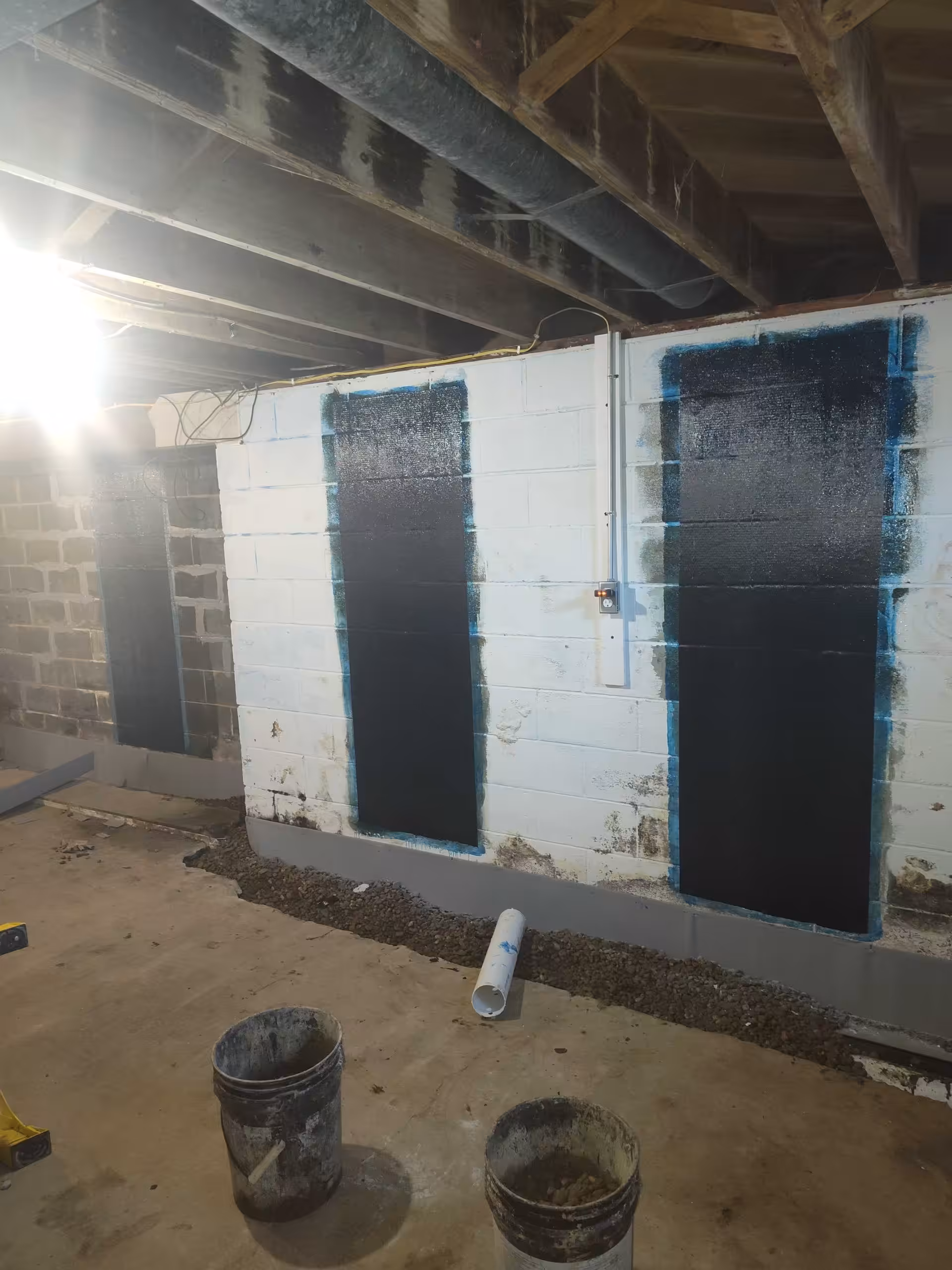 Basement foundation wall repair with waterproofing panels and interior drainage system installation in Cleveland